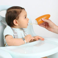 Boon - Squirt silicone baby food Dispensing spoon Orange أداة إطعام من ماركة بون